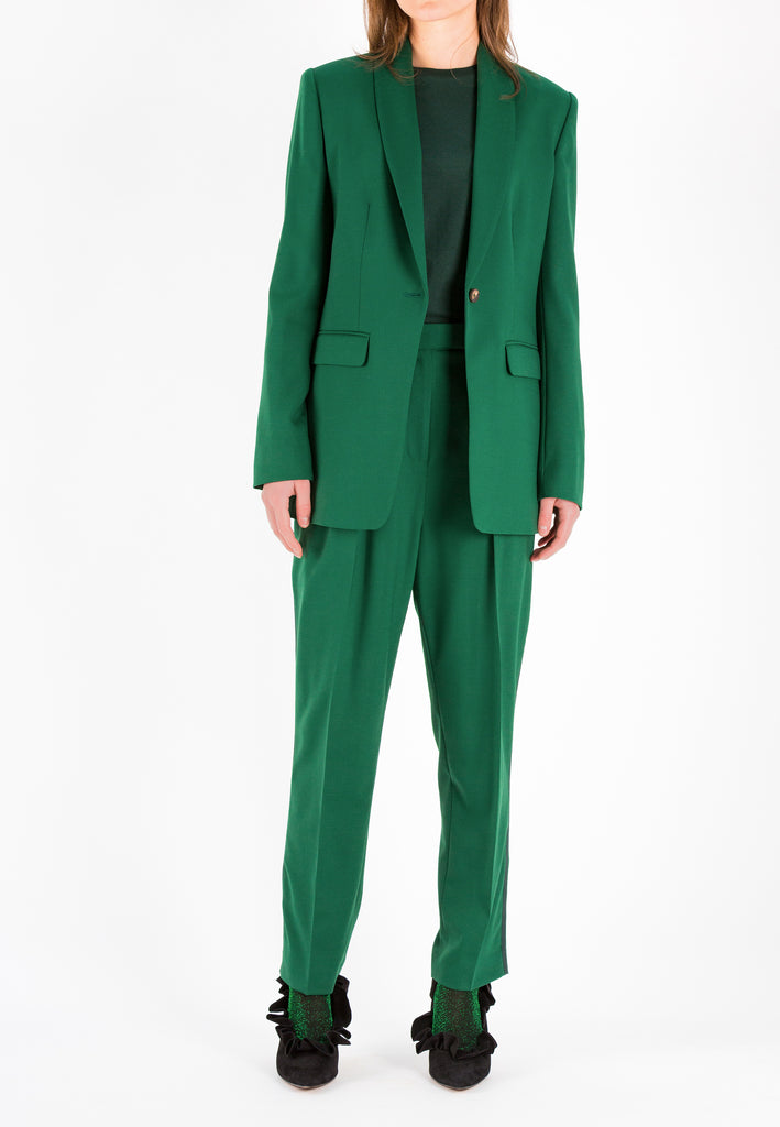Walk | Pants | Bright Green. 54% polyester, 44% wool, 2% elastane. Relaxed fit dropcroth suiting pants. Cropped length. Detailed with a ribbon on the side seam and welt pocket at the back. Zip closure. Also available in dark navy.