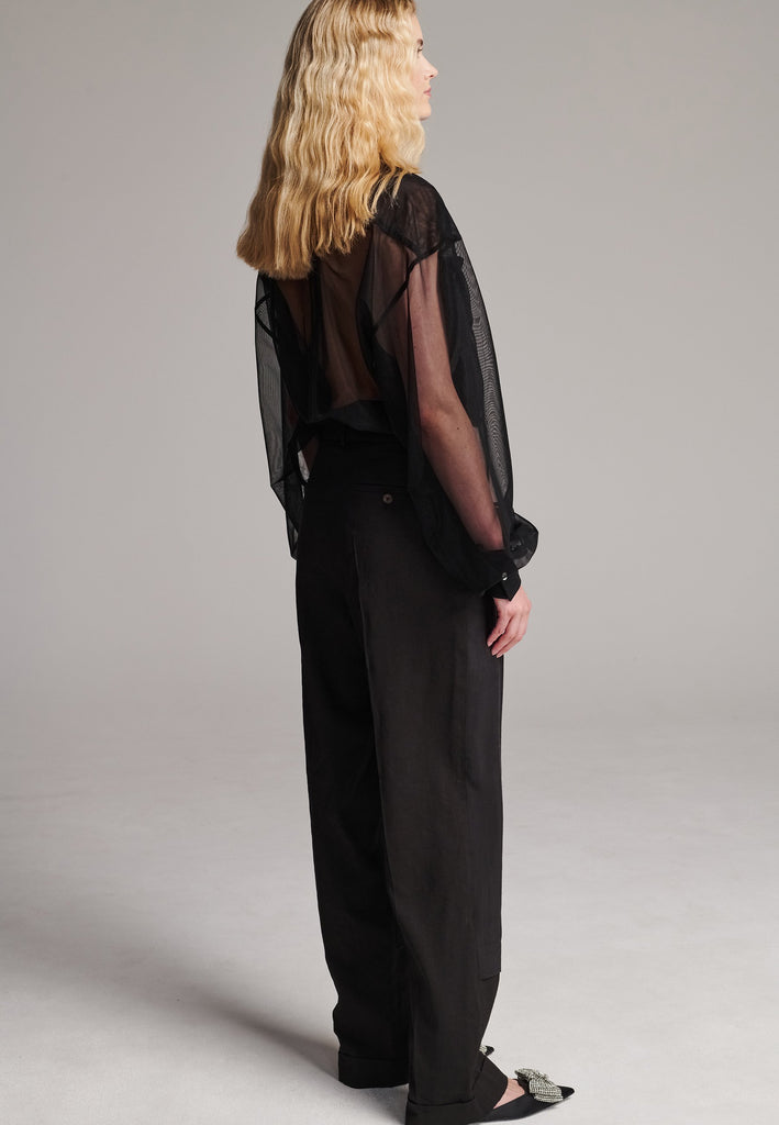 Long wide-leg trousers cut from a linen blend. Detailed with insideout details, welt pockets and button closure.