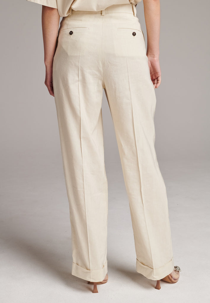 Long wide-leg trousers cut from a linen blend. Detailed with insideout details, welt pockets and button closure.