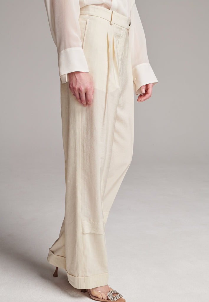 Long wide-leg trousers cut from a linen blend. Detailed with insideout details, welt pockets and button closure.