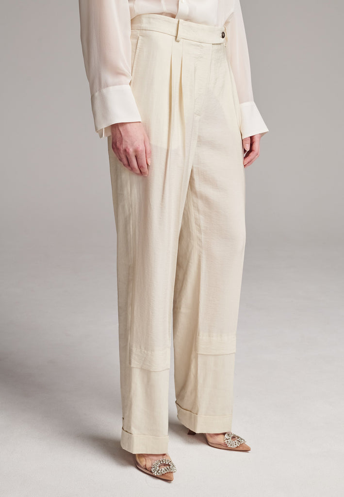 Long wide-leg trousers cut from a linen blend. Detailed with insideout details, welt pockets and button closure.