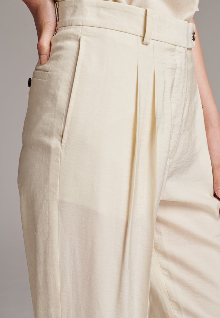 Long wide-leg trousers cut from a linen blend. Detailed with insideout details, welt pockets and button closure.