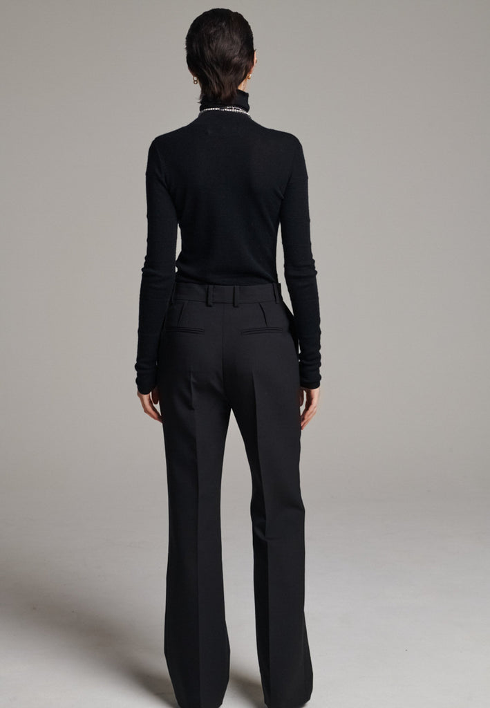 Step into elevated tailoring with the Diamand Darted Boyish Bel Cut Trousers, a structured silhouette with purposefully placed front darts that bring definition and subtle edge. The bell-cut leg adds fluidity, while the slightly oversized, boyish fit channels effortless confidence. Inspired by classic menswear, these trousers blend precision and attitude, making them a standout piece for a polished yet contemporary look.