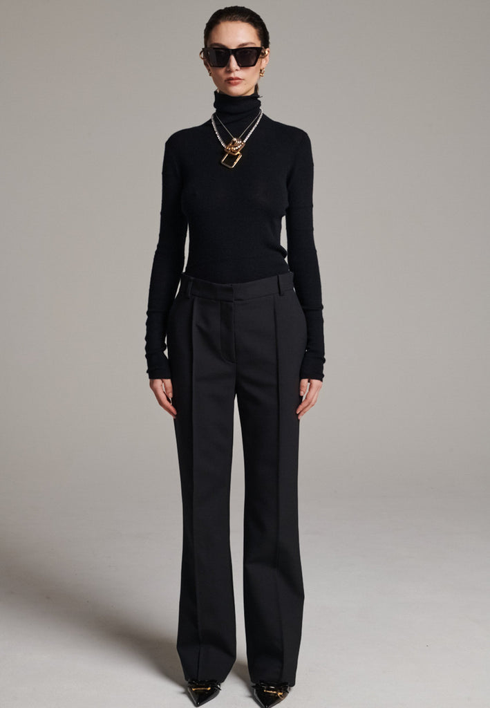 Step into elevated tailoring with the Diamand Darted Boyish Bel Cut Trousers, a structured silhouette with purposefully placed front darts that bring definition and subtle edge. The bell-cut leg adds fluidity, while the slightly oversized, boyish fit channels effortless confidence. Inspired by classic menswear, these trousers blend precision and attitude, making them a standout piece for a polished yet contemporary look.