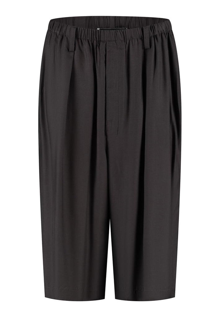 These Found Silk Dark Brown Habotai Pants offer a luxurious, relaxed look with a cropped design that falls just below the knee. Crafted from soft, lightweight silk habotai, they provide a smooth, fluid drape with a subtle sheen. The rich dark brown color adds a touch of sophistication, while the comfortable, slightly loose fit ensures effortless style. Perfect for both casual and semi-formal occasions, these pants are an elevated option for warm-weather dressing or layering with longer pieces.