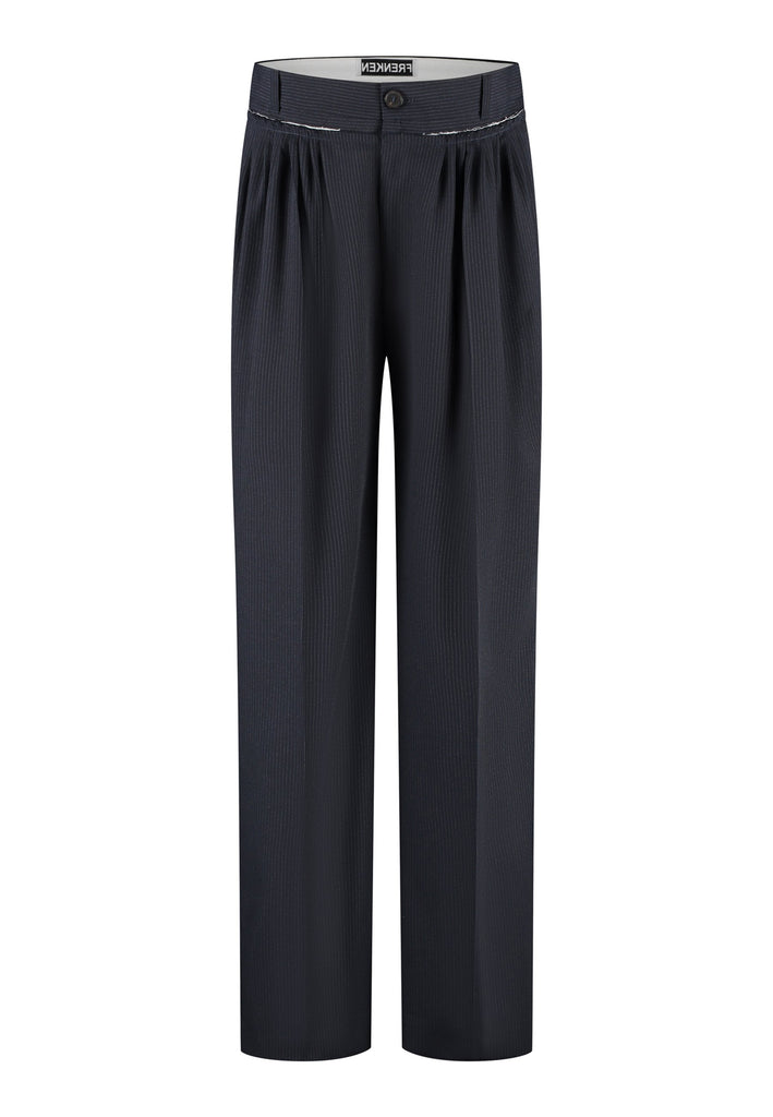 Straight-leg trousers with a classic cut, elevated by subtle yet striking details. The unfinished waistband adds a raw, intentional edge, contrasting with the otherwise clean silhouette. Glossy black fabric stripe runs down the side seams, bringing a touch of texture and definition to the navy pinstripe base. A refined everyday piece with a modern, deconstructed twist.