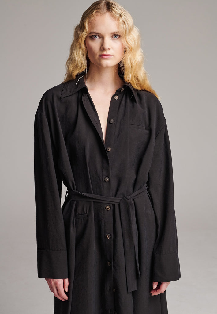 Shirt dresses are closet mainstays that effortlessly evolve from workwear to evening wear. This very cool straight cut, dropped shoulder maxi dress was designed for an oversized fit. Cut from fine crinkle washed look viscose, deepen the front split by unbutton it. Features a belt to cinch in your shape.