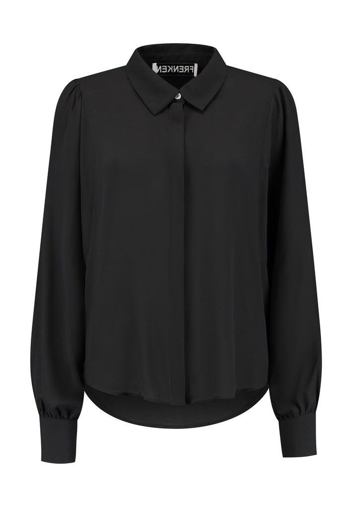 Voluminous poplin shirt with puffed subtle gathered shoulders. Specially detailed with a square armhole seam to create a voluminous sleeve. It has six-hole buttons to adjust the neckline. Cut from 100% silk. Designed for a relaxed fit, cut to be worn very loose. Embellished with a faux pearl on the cuff. This style will go hand in hand with jeans and tailoring.