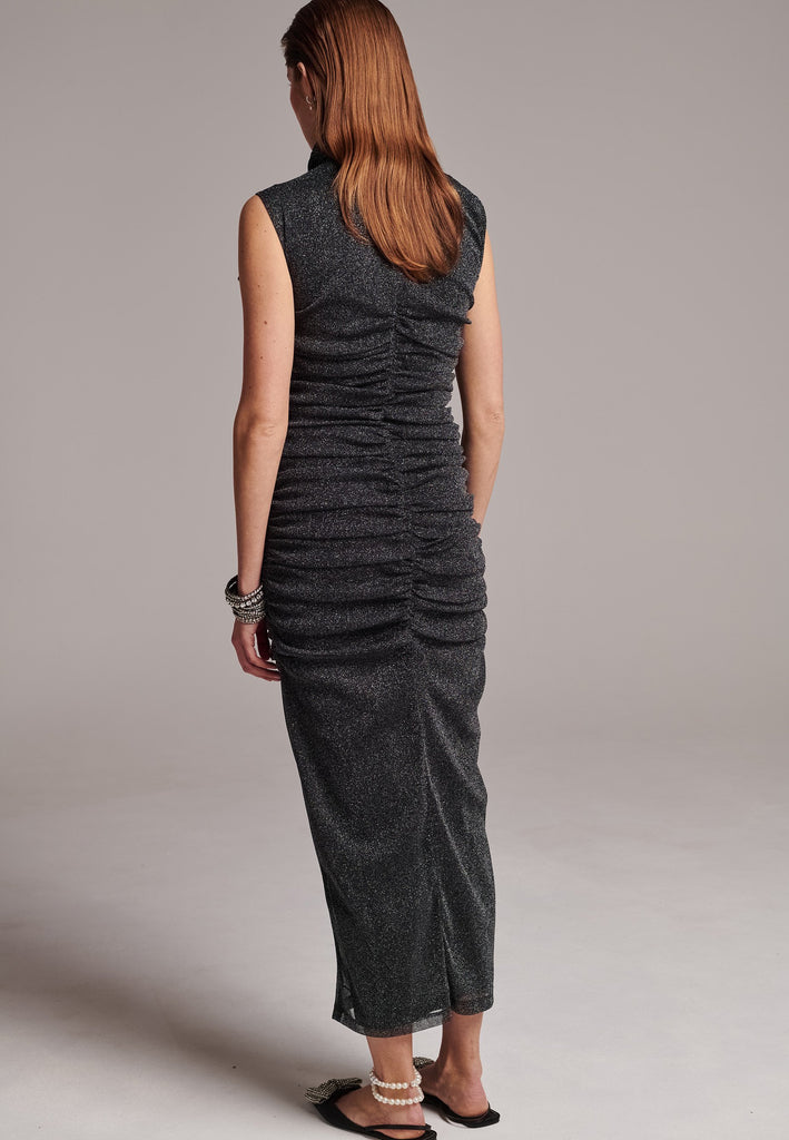 Embrace sophistication with this body-hugging jersey maxi dress. Artfully knotted all-over. Features a body-skimming silhouette.