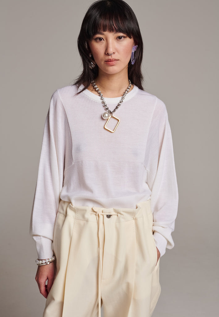 Sweater, crafted from luxurious virgin merino wool that gives a soft handle. Detailed with dropped shoulders, ribbed effect and batwing sleeves. Designed for a loose fit. Long in sleeves. This piece ensures you’ll stay snug and chic, even on the coldest days.