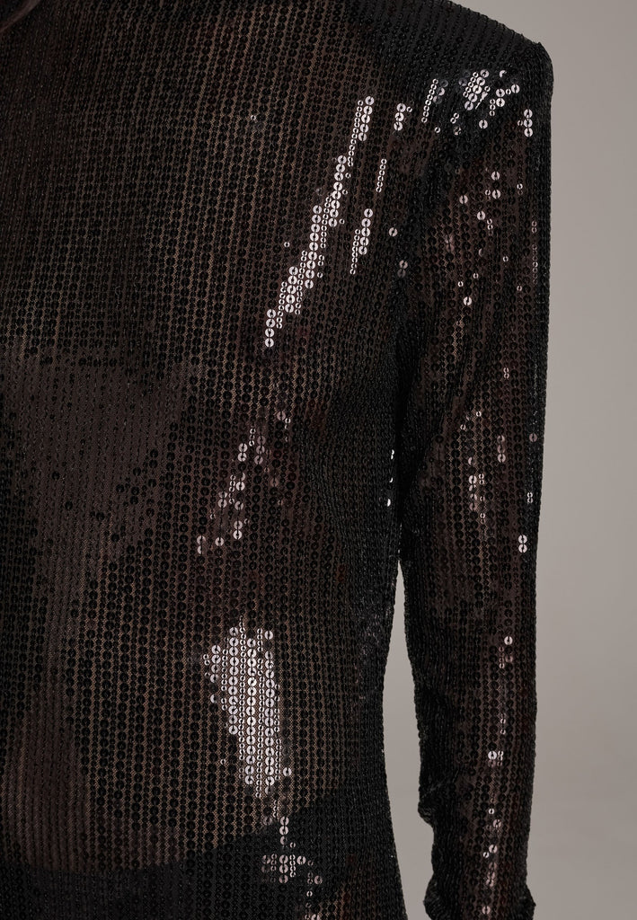 Body-hugging maxi dress, designed for a unique fit. Featuring a see-through shimmer effect, shoulder-pads and turtleneck.