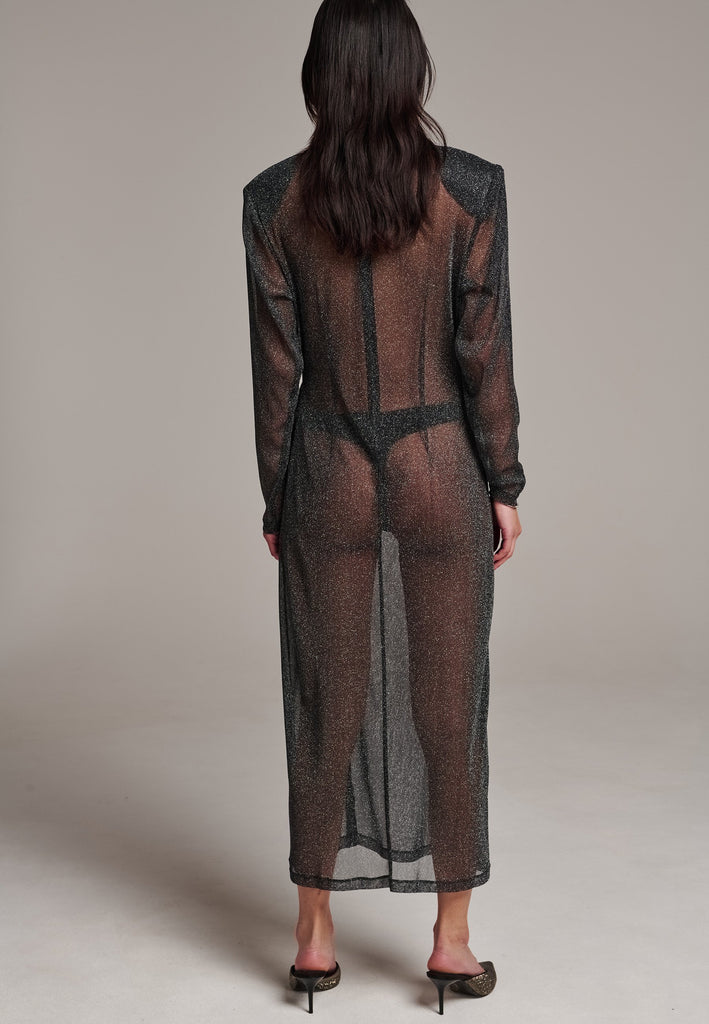 Body-hugging maxi dress, designed for a unique fit. Featuring a see-through shimmer effect and turtleneck.