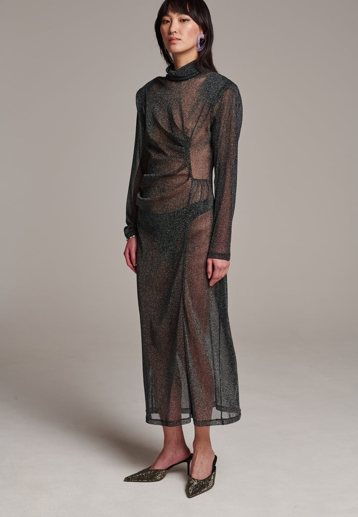 Body-hugging maxi dress, designed for a unique fit. Featuring a see-through shimmer effect and turtleneck.