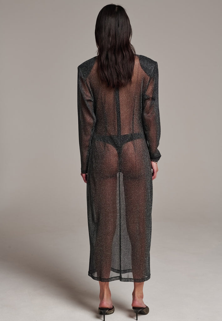 Body-hugging maxi dress, designed for a unique fit. Featuring a see-through shimmer effect and turtleneck.