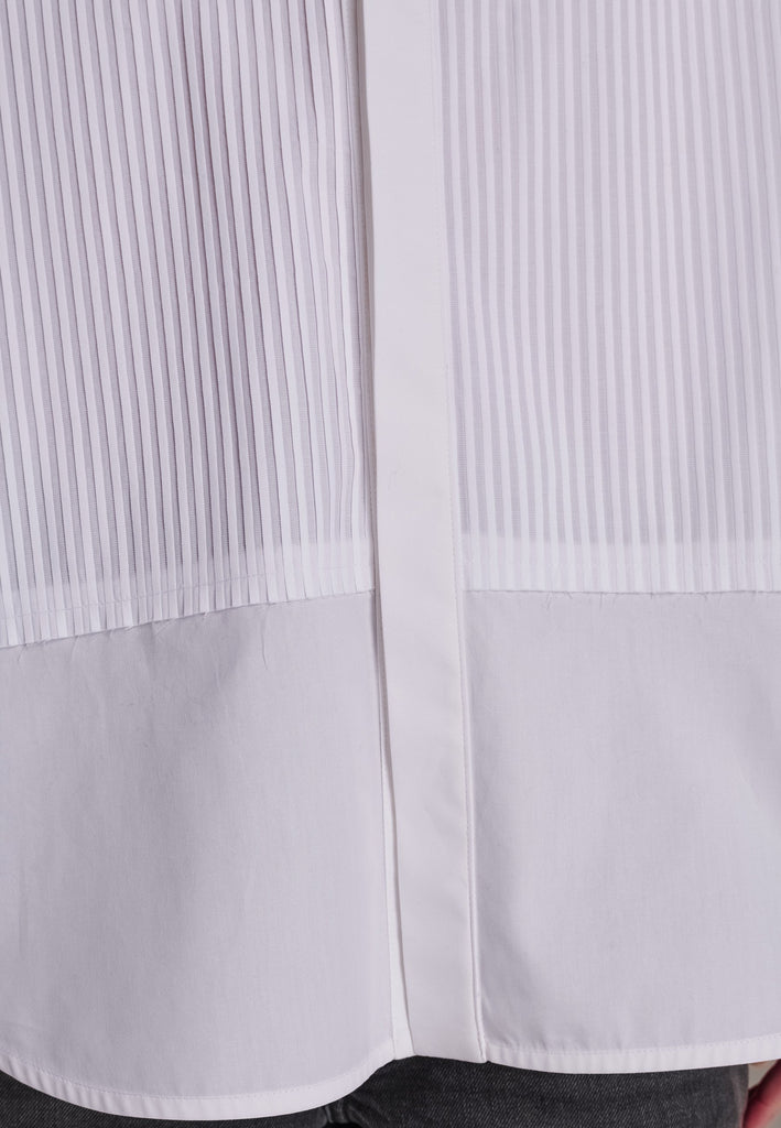 Oversized tuxedo shirt. Loved for its easy elegance, FRENKEN often updates its men-inspired shirts in different fabrics and finishes. This one is cut from tuxedo pleated cotton poplin and has a very oversized loose shape. The styling possibilities are endless - it's truly a must-have.