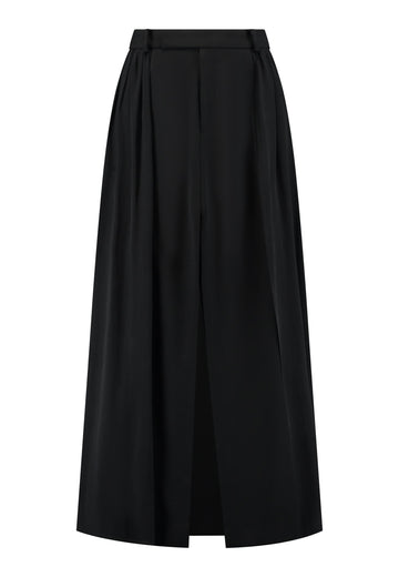 A see-through skirt featuring a front slit and belt loops.