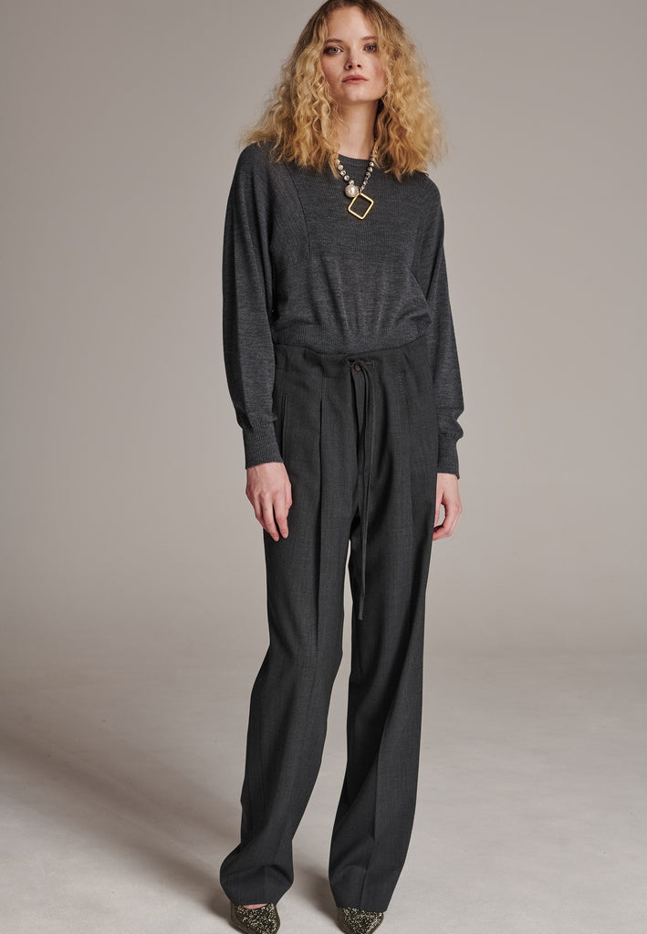 Refine your wardrobe with these straight-leg trousers, cut from a soft virgin wool. Featuring a sophisticated horn button and zip with a drawstring fastening at the waist. With a nod to the tuxedo pants, it has a fabric self-stripe with a needle point at the side seam. Complete with slanted pockets and welt back pockets, these trousers blend traditional elegance with modern functionality.
