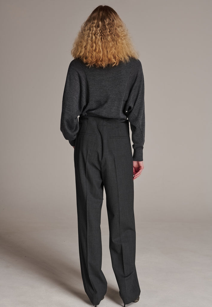 Refine your wardrobe with these straight-leg trousers, cut from a soft virgin wool. Featuring a sophisticated horn button and zip with a drawstring fastening at the waist. With a nod to the tuxedo pants, it has a fabric self-stripe with a needle point at the side seam. Complete with slanted pockets and welt back pockets, these trousers blend traditional elegance with modern functionality.