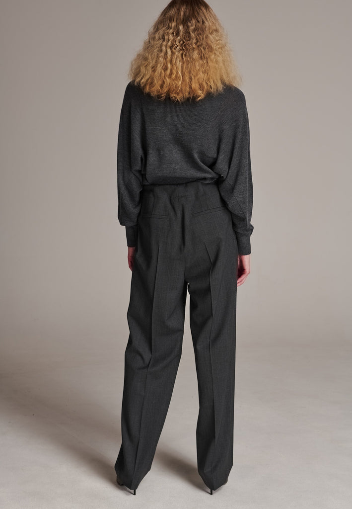 Refine your wardrobe with these straight-leg trousers, cut from a soft virgin wool. Featuring a sophisticated horn button and zip with a drawstring fastening at the waist. With a nod to the tuxedo pants, it has a fabric self-stripe with a needle point at the side seam. Complete with slanted pockets and welt back pockets, these trousers blend traditional elegance with modern functionality.