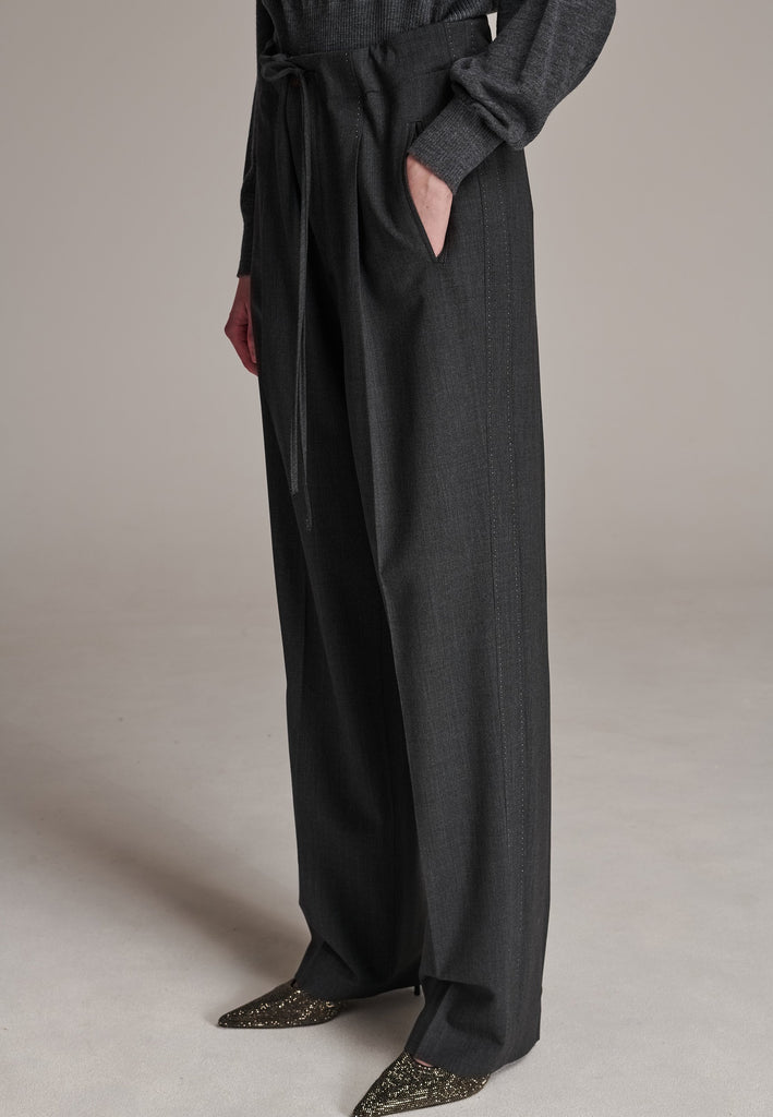 Refine your wardrobe with these straight-leg trousers, cut from a soft virgin wool. Featuring a sophisticated horn button and zip with a drawstring fastening at the waist. With a nod to the tuxedo pants, it has a fabric self-stripe with a needle point at the side seam. Complete with slanted pockets and welt back pockets, these trousers blend traditional elegance with modern functionality.