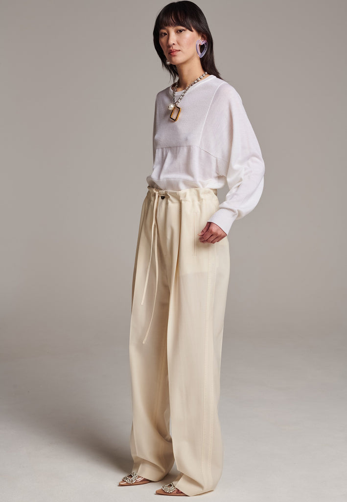Refine your wardrobe with these straight-leg trousers, cut from a soft virgin wool. Featuring a sophisticated horn button and zip with a drawstring fastening at the waist. With a nod to the tuxedo pants, it has a fabric self-stripe with a needle point at the side seam. Complete with slanted pockets and welt back pockets, these trousers blend traditional elegance with modern functionality.