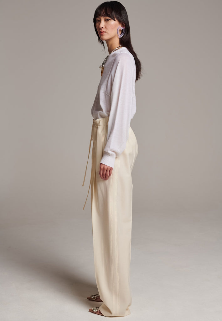 Refine your wardrobe with these straight-leg trousers, cut from a soft virgin wool. Featuring a sophisticated horn button and zip with a drawstring fastening at the waist. With a nod to the tuxedo pants, it has a fabric self-stripe with a needle point at the side seam. Complete with slanted pockets and welt back pockets, these trousers blend traditional elegance with modern functionality.