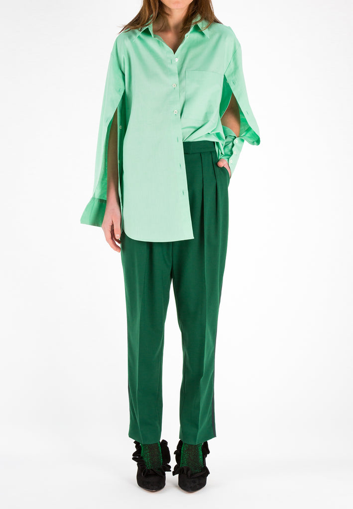 Light Green Oxford Shirt. Oxford cotton boyish shirt in light pistachio pastel green. With buttons at the sleeves and a button at the back yoke. Play with it the way you like it.