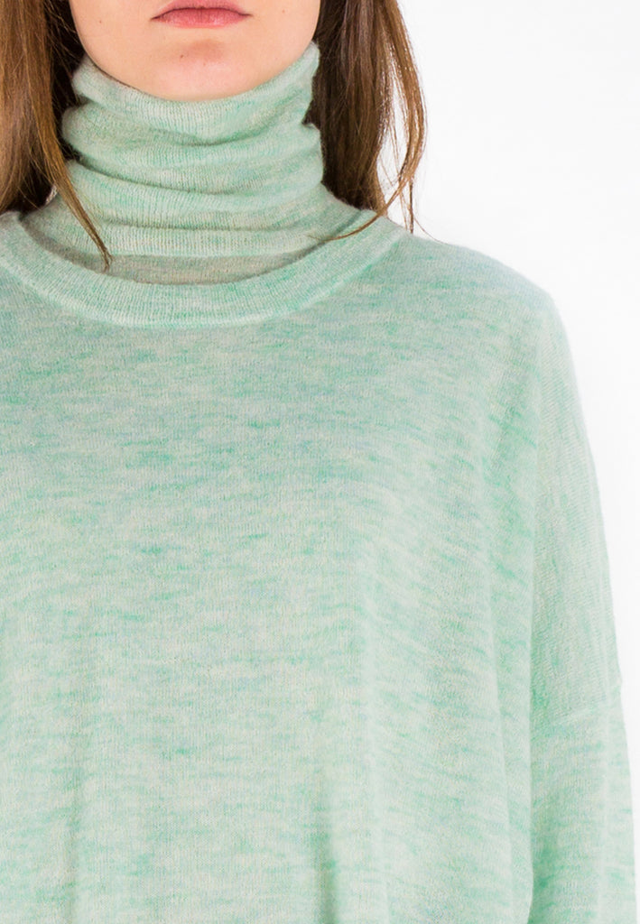 Knit | Light Green. Oversized light knitted sweater. This wool mix has a very soft handfeel. Oneven side seam.