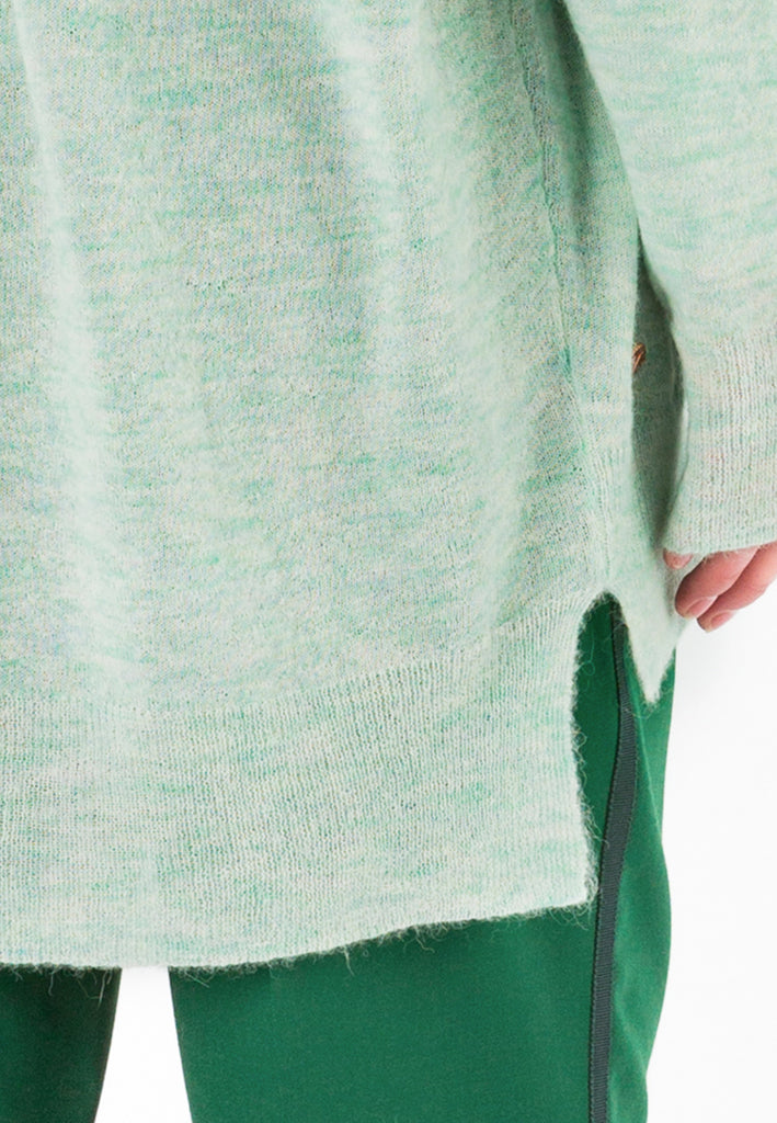 Knit | Light Green. Oversized light knitted sweater. This wool mix has a very soft handfeel. Oneven side seam.
