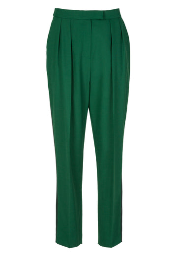 Bright green walk pants. Relaxed fit dropcroth suiting pants. Cropped length. Detailed with a ribbon on the side seam and welt pocket at the back. Zip closure. 