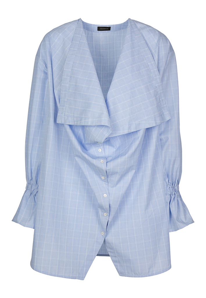Bow | Shirt | Check Light Blue. Oversize poplin shirt. Make a knot with two enlarged front panels. Detailed with puffed cuffs. Fabric: 100% Cotton.