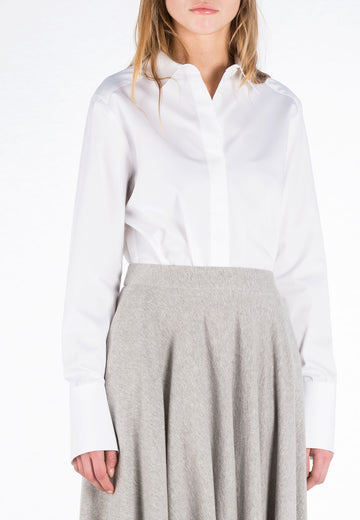 Office shirt. Regular-fit shirt with double cuff length made from white crispy poplin cotton, with classic collar stand and concealed button fly-front. This is a true essential to every wardrobe.