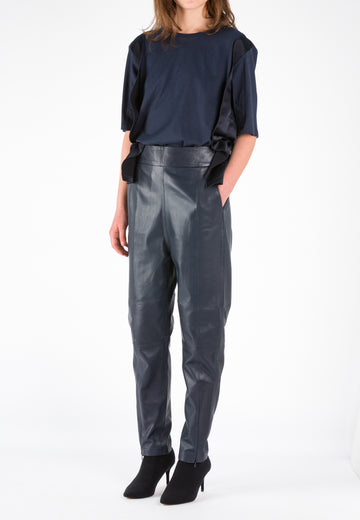 Shine | Top | Navy. Oversized t-shirt with loose-fitting, detailed with satin panels inserted at the side silhouette that creates a ton-sur-ton and matte/shiny effect elevating this basic with a refreshing look. Style it with jeans or leather pant, heels or sneakers, this is an easy-going-with tee.