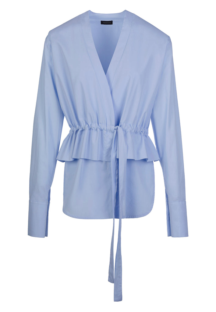 Stash | Top | Light Blue. Wrapped shirt with straps in the waist to create gathering and ruching peplum. The V-neckline and the double-cuff make this white poplin shirt a mix between classic and cool.