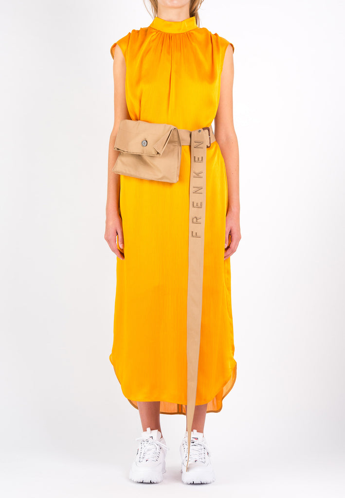 Conceal | Dress | Orange. Maxi dress in a wrinkle flowy satin light fabric. Wear it with the belt to create a waist or wear it without the belt and let the dress hang loose. Model wears a size 36.
