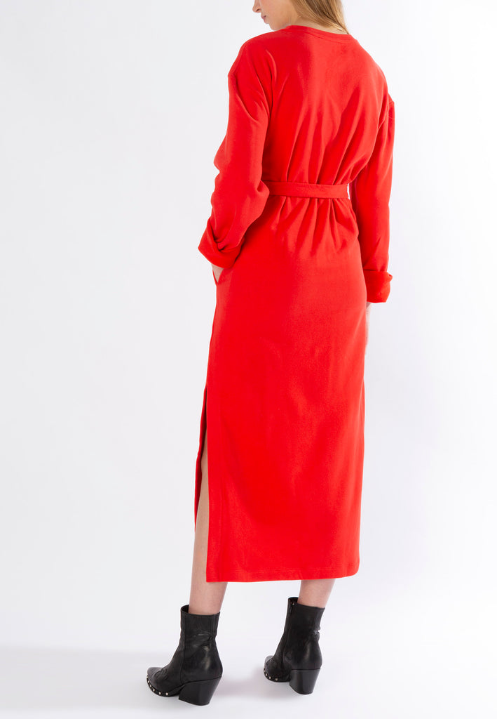 Rink | Dress | Fire Red. 100% cotton. Brushed soft jersey sweat midi dress. This sweater dress is as comfy and effortless. Long sleeves you can roll-up. Detailed with eyelets at the waist and a belt to give some shape.