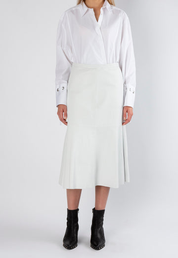 Circular off-white shirt. Midi slightly A-line skirt made from washed leather is cut to hug your curves. It's paneled with subtle ruching. Model wears a size 36.