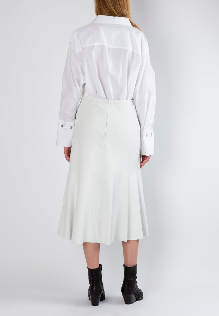Circular off-white shirt. Midi slightly A-line skirt made from washed leather is cut to hug your curves. It's paneled with subtle ruching. Model wears a size 36.