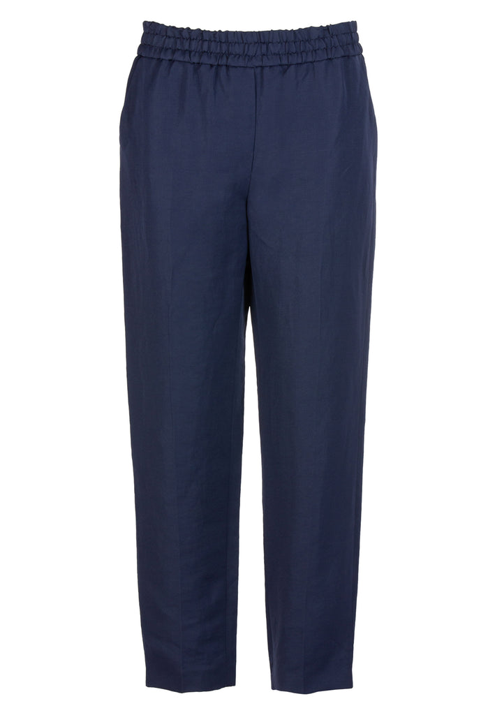 Flowed | Pants | Navy. Easy wear flowy slacks, combining tailoring and leisure in one. This pant is made from a shiny linen blend, mixing an elasticated waistband slightly pleated, a faux front fly, and creases across the legs for the tailored look. This is a home-to-office piece that can easily be styled with a blazer and heels for the tux look or with a sweatshirt and chunky sneakers.