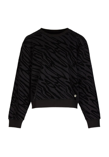 Flock knitted top, black color. Soft jersey sweater with all over zebra flock print. Women clothing.