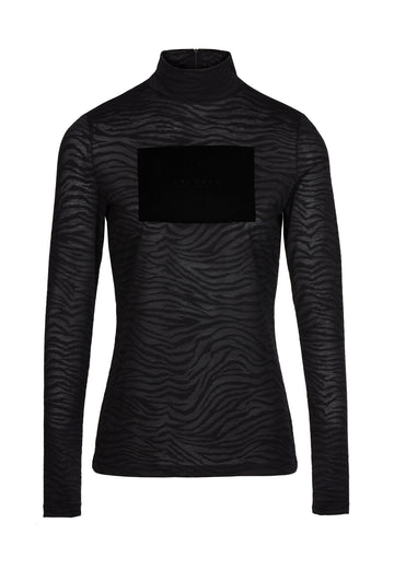 Black knit. Turtle collar neck in black cur from lightweight blended jersey with flock print and velvet finishing. Look closely and you'll see the fabric has a slightly shimmery finish.
