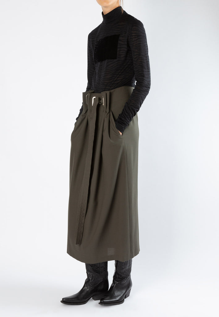 Smocked | Skirt | Forest. Dutch women clothes. Midi skirt with special developed chunky eyelets at the waist. An exaggerated silhouette cut from the finest suiting wool blend.