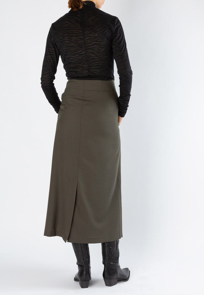 Smocked | Skirt | Forest. Dutch women clothes. Midi skirt with special developed chunky eyelets at the waist. An exaggerated silhouette cut from the finest suiting wool blend.