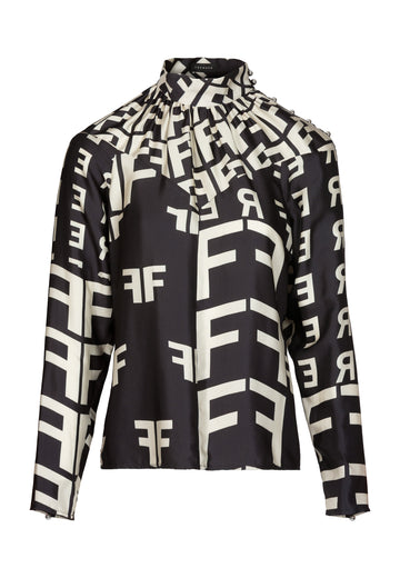 Cross | Top | Black-Aop. Relaxed fitted top with graphic FRENKEN logo allover print. Is cut from flowy satin. Gathered shoulders that create soft volume. Detailed with silver buttons to close the neckline.