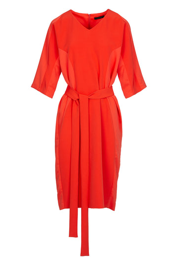 Orange saint dress. Easy-wearing, relaxed fitted, midi dress, with a long belt and lateral satin panels for added detailing. Amsterdam fashion