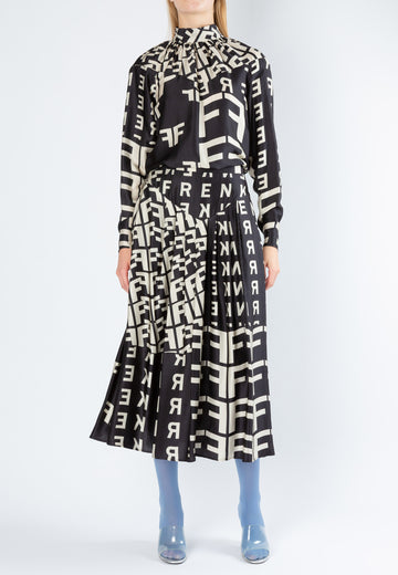 Race | Skirt | Black-Aop. Midi skirt with graphic FRENKEN logo allover print. It's cut from flowy satin. Mid flaring skirt softly pleated to create the most graceful movement. It has a fitted waistband.