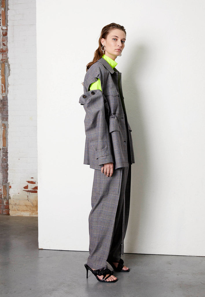 High-waisted trousers tailored from a wool-blend. It's cut in a slightly tapered leg. Designed to sit high on the waist, they have sharp front pleats. Detailed with a padded long belt. This utilitarian-inspired is fitted with oversized flap pockets.
