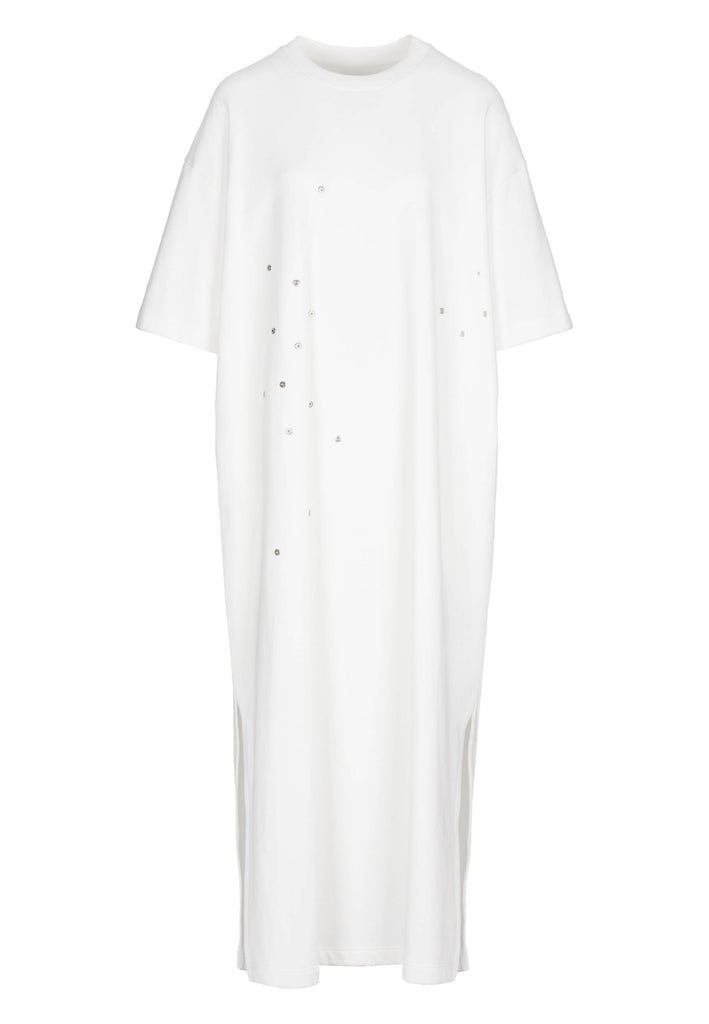 Peak | Dress | Off-white. Maxi dress fabricated in soft off-white interlock. The dropped sleeves emphasize the oversized look, with metallic eyelets and press buttons, inspired by the functionality, for an unexpected leisurewear statement piece. With side slits for extra comfort, to wear inside and out.