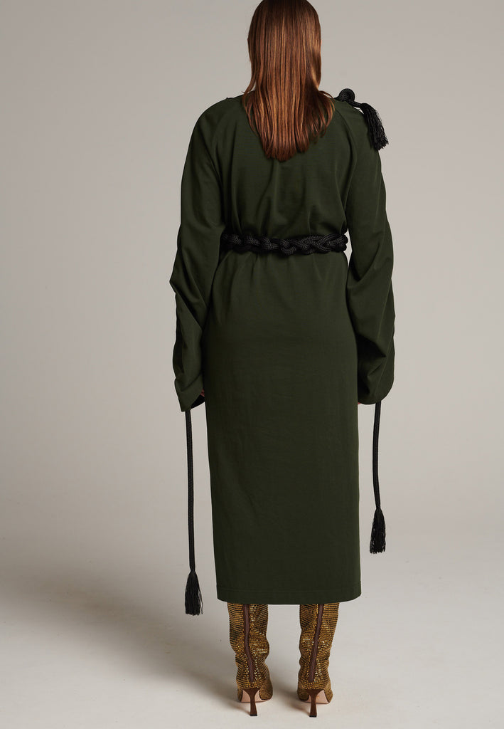 FRENKEN oversized jersey dress with long wide sleeves crafted in soft light dark green cotton, detailed with this season's cord theme. The chunky cords are displayed along the sleeves and can be pulled out to create shape and to shorten the sleeves, making the most of this statement style. The cord ends are hand frayed, a refined couture detail.