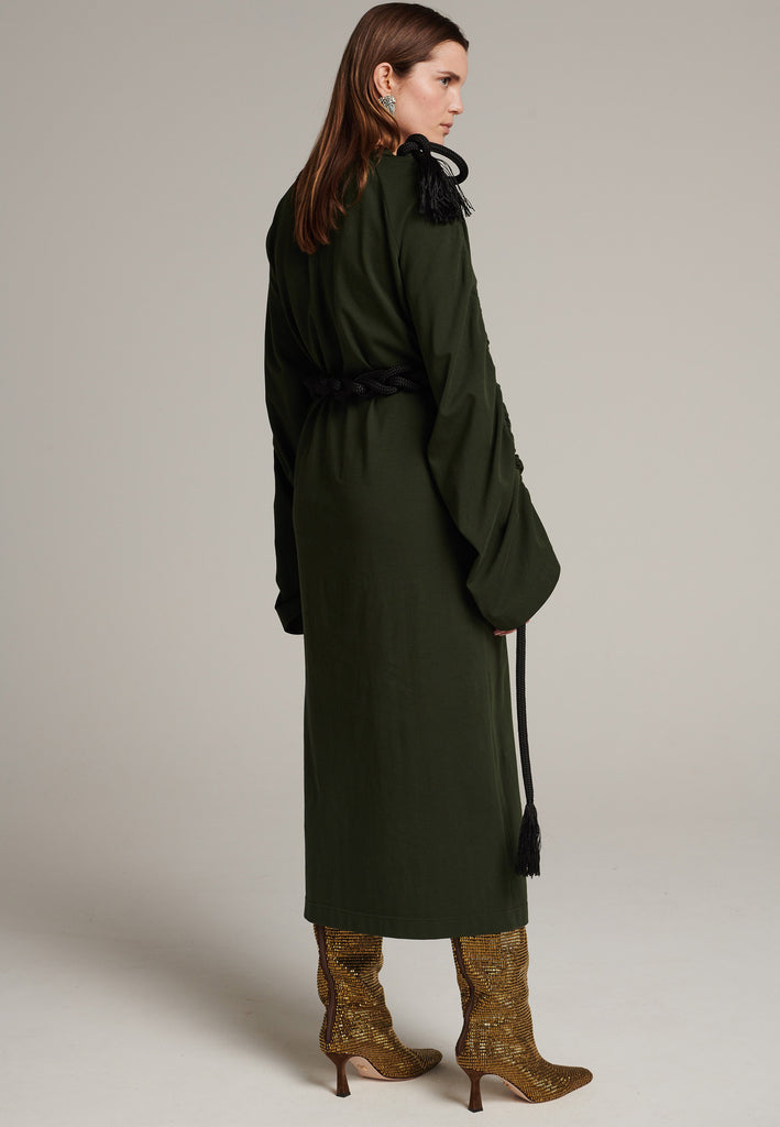 FRENKEN oversized jersey dress with long wide sleeves crafted in soft light dark green cotton, detailed with this season's cord theme. The chunky cords are displayed along the sleeves and can be pulled out to create shape and to shorten the sleeves, making the most of this statement style. The cord ends are hand frayed, a refined couture detail.